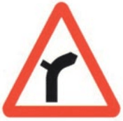 Junction on bend from left ahead